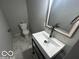 Updated bathroom with modern vanity and gray tile floors at 334 Hamilton Ave, Indianapolis, IN 46201