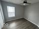 Bright bedroom with ceiling fan and vinyl plank flooring at 334 Hamilton Ave, Indianapolis, IN 46201