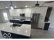 Modern kitchen with white and blue cabinets and quartz countertops at 334 Hamilton Ave, Indianapolis, IN 46201