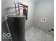 Laundry room with new water heater and tile flooring at 334 Hamilton Ave, Indianapolis, IN 46201