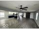 Open concept living area with kitchen island and hardwood floors at 334 Hamilton Ave, Indianapolis, IN 46201