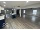 Open concept living area with kitchen island and hardwood floors at 334 Hamilton Ave, Indianapolis, IN 46201