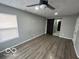 Main bedroom with barn door to ensuite bathroom and vinyl plank flooring at 334 Hamilton Ave, Indianapolis, IN 46201