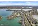 Community aerial view showcasing waterfront homes, scenic landscaping, and sparkling blue water at 3543 Clearwater Cir, Indianapolis, IN 46240