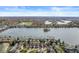 Expansive aerial view of a lake community featuring well-maintained homes with mature trees and waterfront access at 3543 Clearwater Cir, Indianapolis, IN 46240