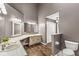A well-lit ensuite bathroom with a separated vanity and toilet areas at 3543 Clearwater Cir, Indianapolis, IN 46240