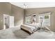 Large bedroom with multiple windows and an ensuite bathroom entryway at 3543 Clearwater Cir, Indianapolis, IN 46240