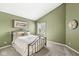 Cozy bedroom with a neutral colored carpet and accent wall at 3543 Clearwater Cir, Indianapolis, IN 46240