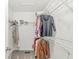 Walk-in closet with metal shelving and hanging clothes at 3543 Clearwater Cir, Indianapolis, IN 46240