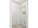 Clean, small storage closet with shelving and hooks for optimal organization at 3543 Clearwater Cir, Indianapolis, IN 46240