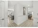 Bright hallway leading to the kitchen and living room, featuring tiled floors and elegant wall accents at 3543 Clearwater Cir, Indianapolis, IN 46240