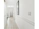 Bright hallway with tiled floor leading to the home's entry, well-lit with overhead lighting at 3543 Clearwater Cir, Indianapolis, IN 46240