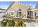 Back exterior view showing a screened porch and yard at 3543 Clearwater Cir, Indianapolis, IN 46240