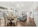 Sun-filled open floor plan showcasing the living and dining spaces with seamless flow and hardwood floors at 3543 Clearwater Cir, Indianapolis, IN 46240