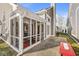 Cozy screened porch with a red rug and seating at 3543 Clearwater Cir, Indianapolis, IN 46240