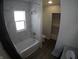 Updated bathroom with a bathtub, shower, and modern vanity at 3608 N Kenwood Ave, Indianapolis, IN 46208