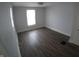 Spacious bedroom with hardwood floors and large window at 3608 N Kenwood Ave, Indianapolis, IN 46208