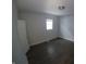Spacious bedroom with dark gray wood flooring and wainscoting at 3608 N Kenwood Ave, Indianapolis, IN 46208