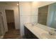 Bright bathroom featuring a double sink vanity with a sleek countertop and a large mirror at 3945 Highcrest Rd, Indianapolis, IN 46239