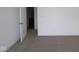 Bedroom with neutral carpet, white walls and a view to an en-suite bathroom at 3945 Highcrest Rd, Indianapolis, IN 46239