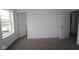 Neutral bedroom featuring plush carpeting, a bright window, and ample closet space at 3945 Highcrest Rd, Indianapolis, IN 46239