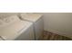 The image showcases a laundry area with a washer and dryer set against a white wall at 3945 Highcrest Rd, Indianapolis, IN 46239