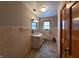 Bathroom with tiled walls, vanity, and bathtub at 407 Hawthorne Ln, Greenfield, IN 46140
