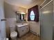 Clean bathroom with tiled walls, shower, and vanity at 407 Hawthorne Ln, Greenfield, IN 46140