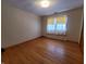 Bright bedroom with hardwood floors and ample window light at 407 Hawthorne Ln, Greenfield, IN 46140