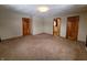 Spacious main bedroom with carpet and access to bathroom at 407 Hawthorne Ln, Greenfield, IN 46140