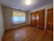 Bright bedroom with hardwood floors and ample closet space at 407 Hawthorne Ln, Greenfield, IN 46140