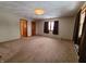 Large bedroom with carpet and two windows at 407 Hawthorne Ln, Greenfield, IN 46140