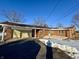 Brick ranch house with attached garage and snow-covered yard at 407 Hawthorne Ln, Greenfield, IN 46140