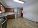 Modern kitchen with stainless steel appliances and tile flooring at 407 Hawthorne Ln, Greenfield, IN 46140