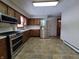 Modern kitchen with stainless steel appliances and tile flooring at 407 Hawthorne Ln, Greenfield, IN 46140