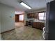 Updated kitchen with stainless steel appliances and tile floor at 407 Hawthorne Ln, Greenfield, IN 46140