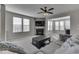 Spacious living room featuring a fireplace, large TV, and comfortable seating at 4623 Creighton Ln, Indianapolis, IN 46237