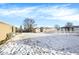 Large backyard with shed and partial snow cover at 4641 W Ridge Dr, Columbus, IN 47203