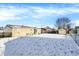 Snowy backyard with shed and fence at 4641 W Ridge Dr, Columbus, IN 47203