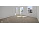 Bedroom with natural light from two windows and neutral carpeting throughout at 5144 Rolling Meadow Blvd, Indianapolis, IN 46237