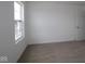 Bedroom with neutral carpet, a window, and white trim at 5144 Rolling Meadow Blvd, Indianapolis, IN 46237