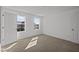 Bedroom featuring natural light from two windows and neutral carpeting at 5144 Rolling Meadow Blvd, Indianapolis, IN 46237