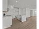 Modern kitchen with white cabinets, stainless steel appliances and hardwood floors at 5144 Rolling Meadow Blvd, Indianapolis, IN 46237