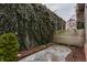 Private backyard retreat with lush greenery and a stone patio, offering a serene escape at 634 E Vermont St, Indianapolis, IN 46202