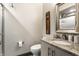 Small bathroom with granite vanity and walk-in shower at 634 E Vermont St, Indianapolis, IN 46202