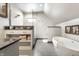 Spa-like bathroom with soaking tub, walk-in shower, and granite vanity at 634 E Vermont St, Indianapolis, IN 46202