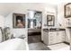 Bathroom with freestanding tub, granite vanity, and view to bedroom at 634 E Vermont St, Indianapolis, IN 46202