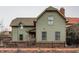 Charming two-story home boasts a classic design, complete with a well-maintained yard and inviting facade at 634 E Vermont St, Indianapolis, IN 46202