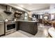 Updated kitchen with stainless steel appliances and island seating at 634 E Vermont St, Indianapolis, IN 46202