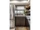 Modern kitchen with stainless steel appliances and farmhouse sink at 634 E Vermont St, Indianapolis, IN 46202